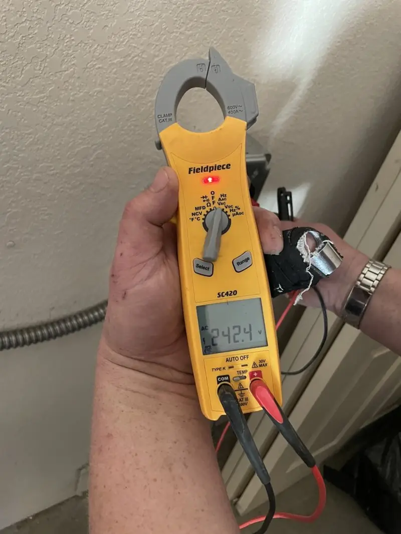 Voltage testing with clamp meter during Outlet Installation in New Paltz